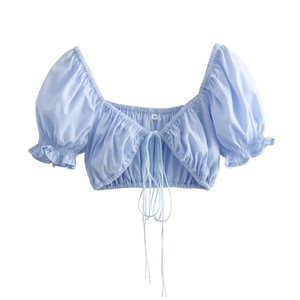 Women's light blue slim fit top with flare sleeves and lace-up front detail