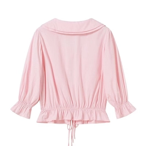 Detail view of pink and white striped shirt with sailor collar and adjustable drawstring hem