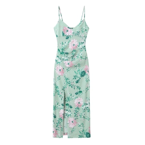 Detailed view of linen floral midi dress featuring side ruched pleats and a high slit