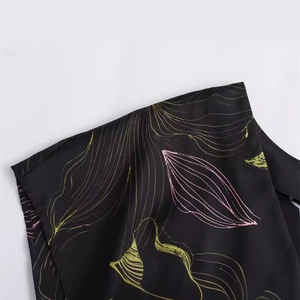 Black satin midi dress with pink and green abstract leaf prints and silky texture