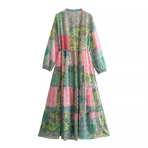 Bohemian floral maxi dress with patchwork print, long sleeves and tiered skirt details