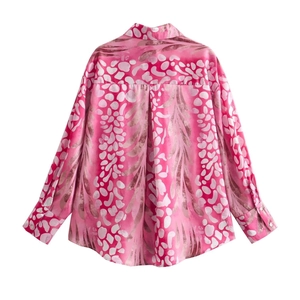 Detail of printed satin long sleeve shirt featuring back pleat and pink boho plant patterns