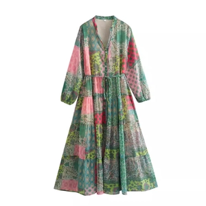 Bohemian V-neck floral printed maxi dress with long sleeves and tiered cake skirt