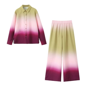 Flat lay of women's long sleeve gradient shirt and high waist wide leg pants set in green and purple