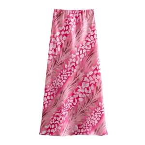 Detailed close-up of pink leopard print midi skirt with elastic waist and satin finish
