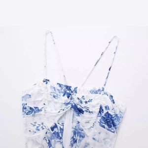 Women's summer floral print sundress with thin straps and blue floral patterns