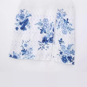 Women's summer white dress with blue floral print and elegant side slit hem detail