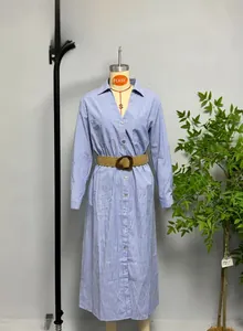 Detail of blue and white striped shirt dress featuring a brown braided belt and button front