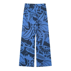 Detail view of floral print trousers with back pocket and abstract blue leaf pattern