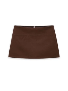 Detail view of a dark brown mini skirt showing the seamless waist and size S label