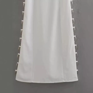 White slim dress with silver metal ring details and side cutout design for women