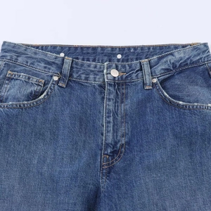 Deep blue washed vintage balloon jeans with mid-rise belt loops and metal button