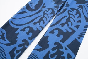 Detail shot of the elastic blue and black floral print fabric on the summer trousers