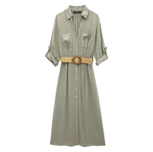 Close-up of sage green linen blend shirt dress featuring woven belt and cargo pockets