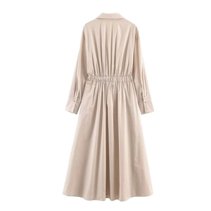 Back view of a beige long-sleeve midi shirt dress with belted waist and A-line silhouette