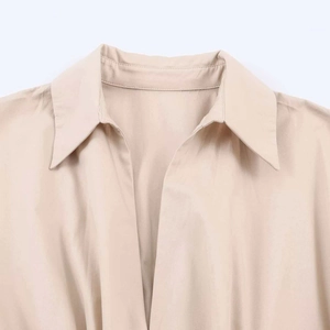 Minimalist beige midi dress with pointed lapel collar and clean V-neckline stitching