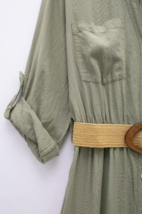 Detail of green linen blend shirt dress with chest pocket and woven straw belt