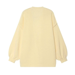Pale yellow oversized knit sweater featuring drop shoulder design and ribbed cuffs