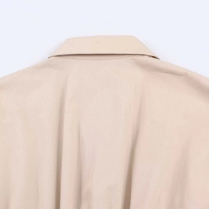 Detail of khaki twill fabric and premium stitching on the back neckline of the midi dress