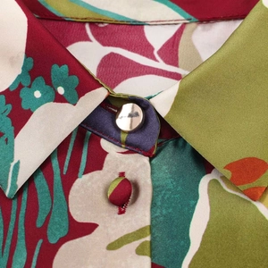 Vintage floral satin shirt with elegant collar detailing and metallic silver button closure