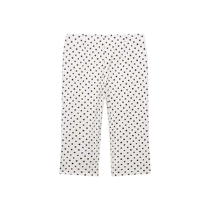 Detailed view of high-waisted white polka dot straight-leg trousers with clean print
