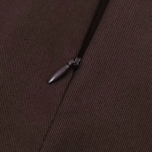 Detail showing the invisible zipper closure on brown twill fabric for a high-waisted skort