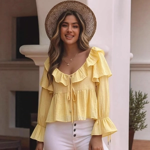 Off-shoulder yellow chiffon blouse with ruffle details and V-neck tie for summer vacation