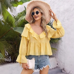 Bright yellow off-shoulder chiffon blouse with ruffles and flared sleeves for summer holidays
