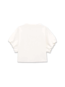 Detail of white ribbed knit top featuring elegant puff sleeves and a chic crew neck design