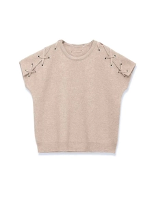 Detail of beige knit vest with shoulder lace-up straps and metallic eyelets