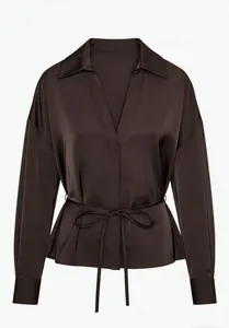 Close-up of dark coffee satin shirt featuring elegant lapel and waist tie detail