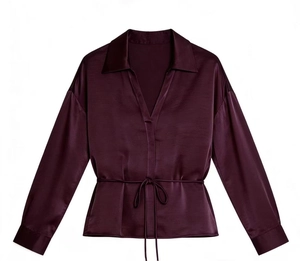 Detail view of deep purple satin shirt with lapel collar and adjustable waist drawstring
