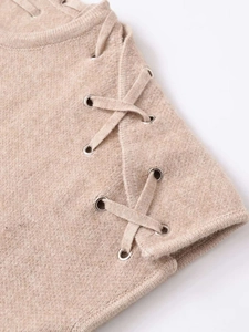 Detail view of khaki knitted vest featuring side lace-up ties and silver metal eyelets