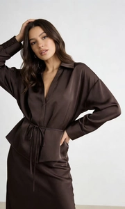 Close-up of chocolate brown satin shirt detailing collar, long sleeves and silk texture