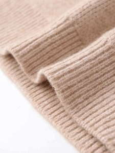 Close-up of oatmeal ribbed knit fabric with soft texture and high elasticity detail
