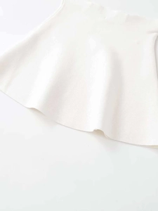Detailed view of white knitted fabric texture and premium hem stitching on the skirt