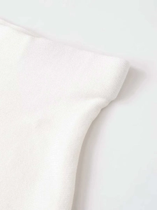 Detail shot of the white knitted fabric with fine mesh texture and stand collar stitching