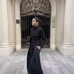 Chic black standing collar jacket with vintage frogging buttons and wide-leg pants
