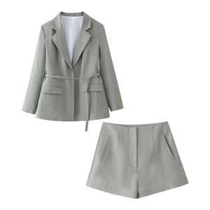 Women's 2-piece grey blazer and high waist shorts set with belt on white background