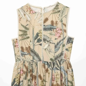 Floral print sleeveless mini dress with white lace trim and tropical bird motifs