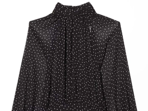 Detail of high neck pleats and back invisible zipper on black polka dot chiffon dress