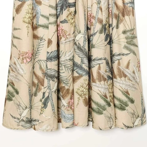 Tropical floral print midi dress featuring hummingbird and palm leaf patterns