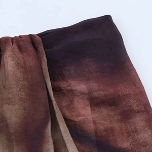 Detailed macro shot of vintage gradient dyed fabric with purple and brown tones