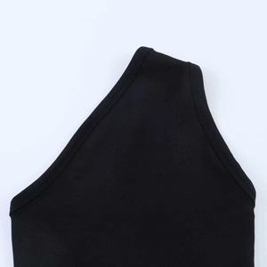 Macro detail of black ribbed fabric showing fine stitching and thick elastic texture