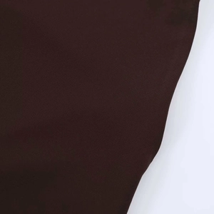 Close-up of matte dark brown elastic fabric texture for a boat neck mini dress