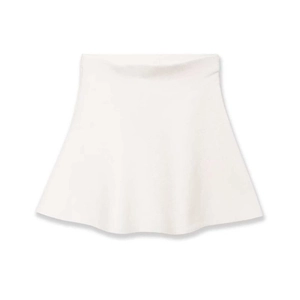 Minimalist white high-waisted A-line knit mini skirt with subtle textured fabric