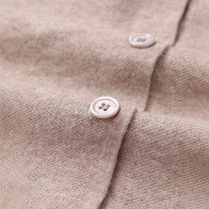 Minimalist summer knit cardigan in beige with fine texture and tonal resin buttons