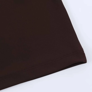 Detail of the high-density knitted fabric hem with flat double-needle stitching on dark brown dress