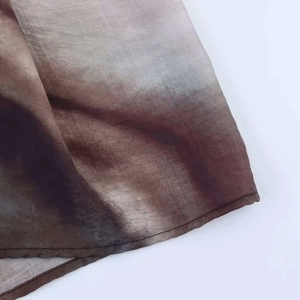 Detail view of ombre gradient fabric showing neat stitching on a summer midi skirt hem