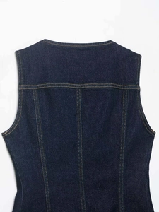 Detail of dark blue denim vest featuring orange contrast stitching and twill texture